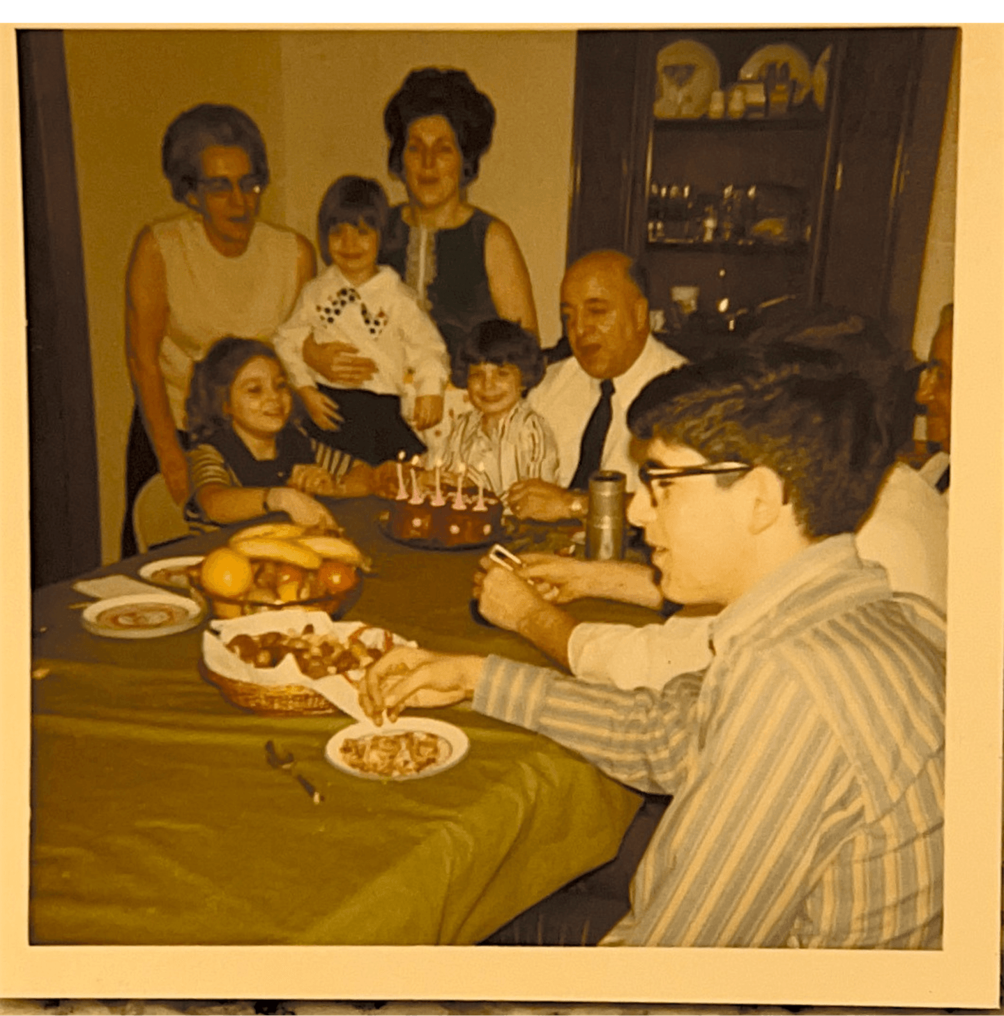 An archival McGinnis family gathering around a birthday table
